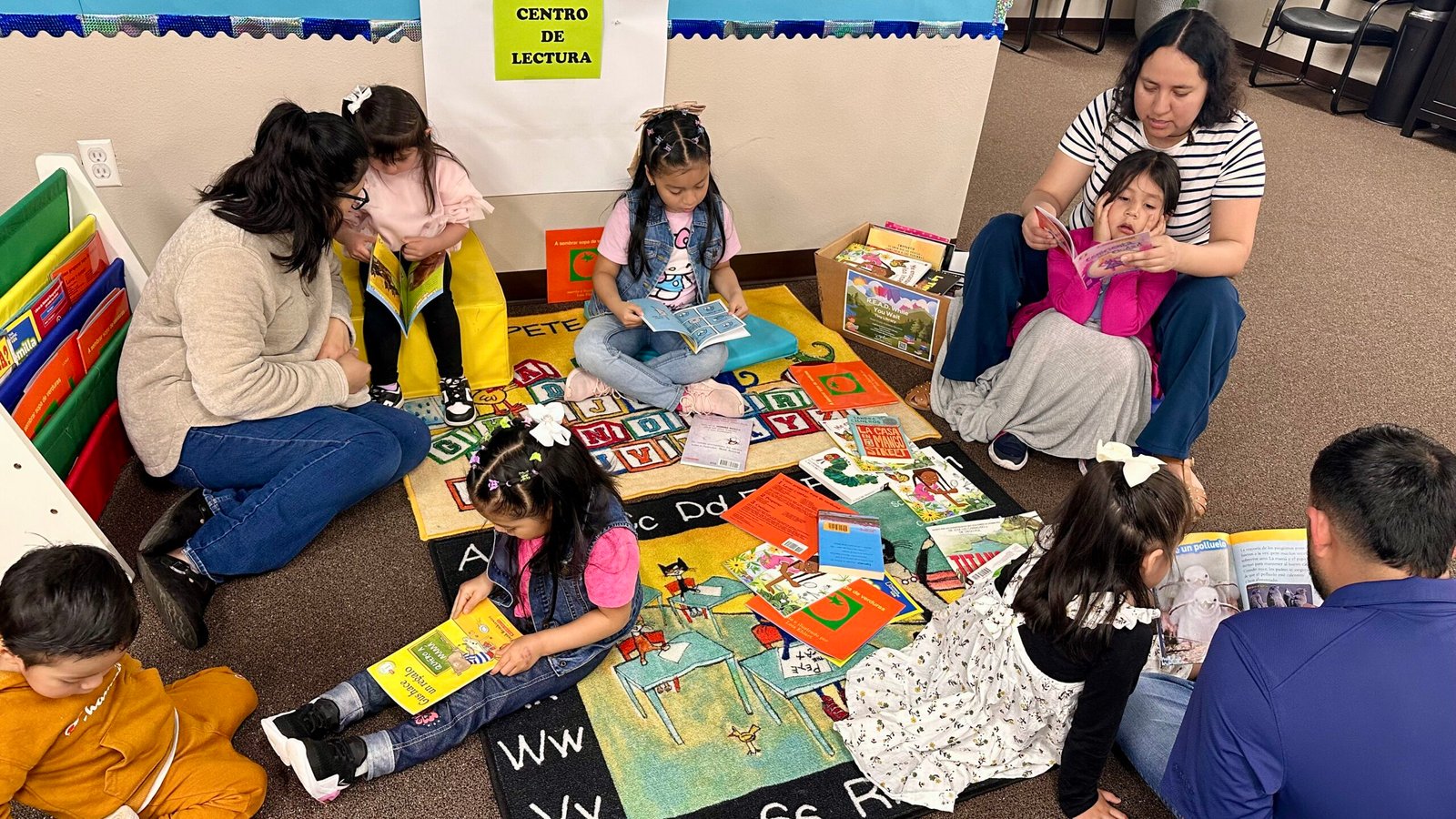 Reading area, parents reading to and with their kids.